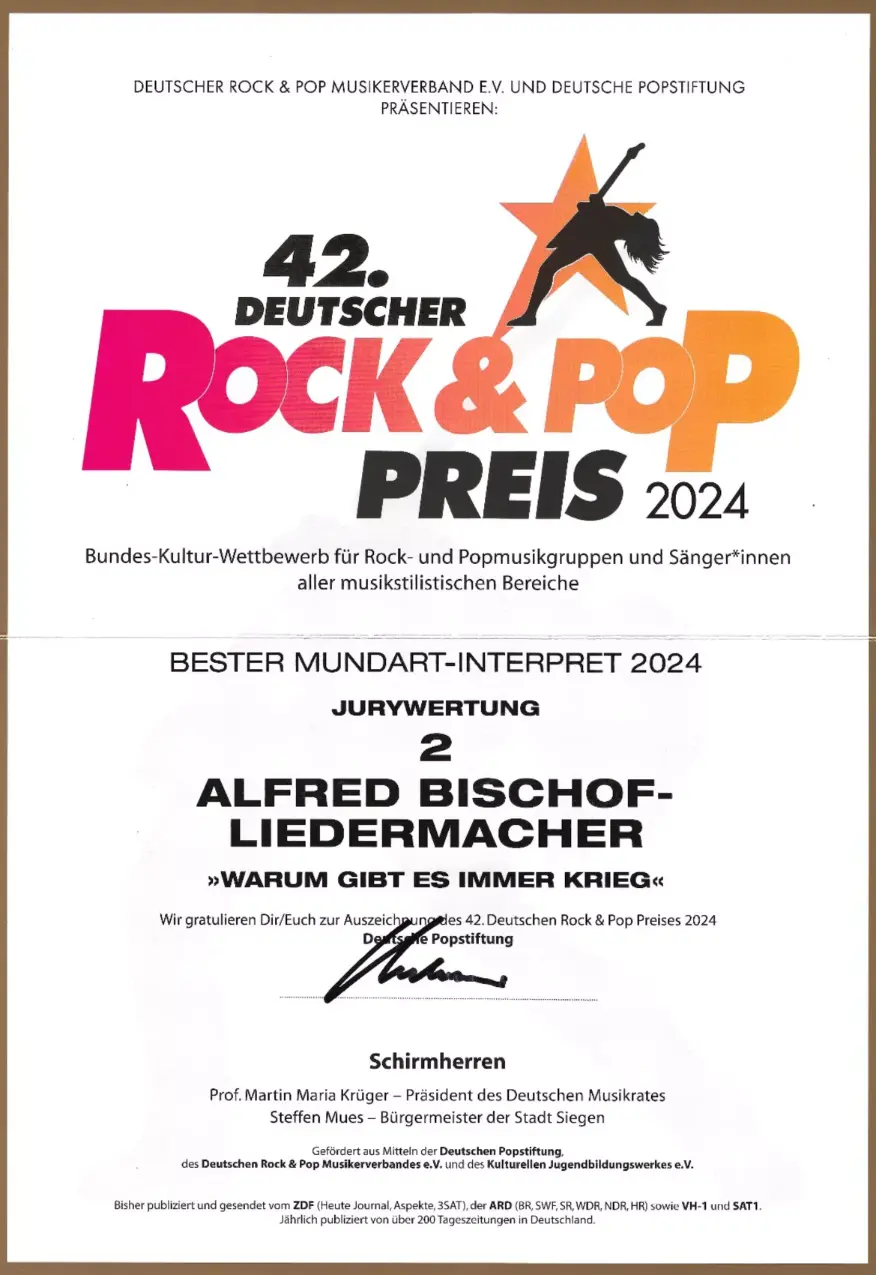 Alfred Bischof erhält 2024 den Preis als bester Mundart-Interpret für den Song „Warum gibt es immer Krieg“. Alfred Bischof erhält 2024 den Preis als bester Mundart-Interpret für den Song „Warum gibt es immer Krieg“.